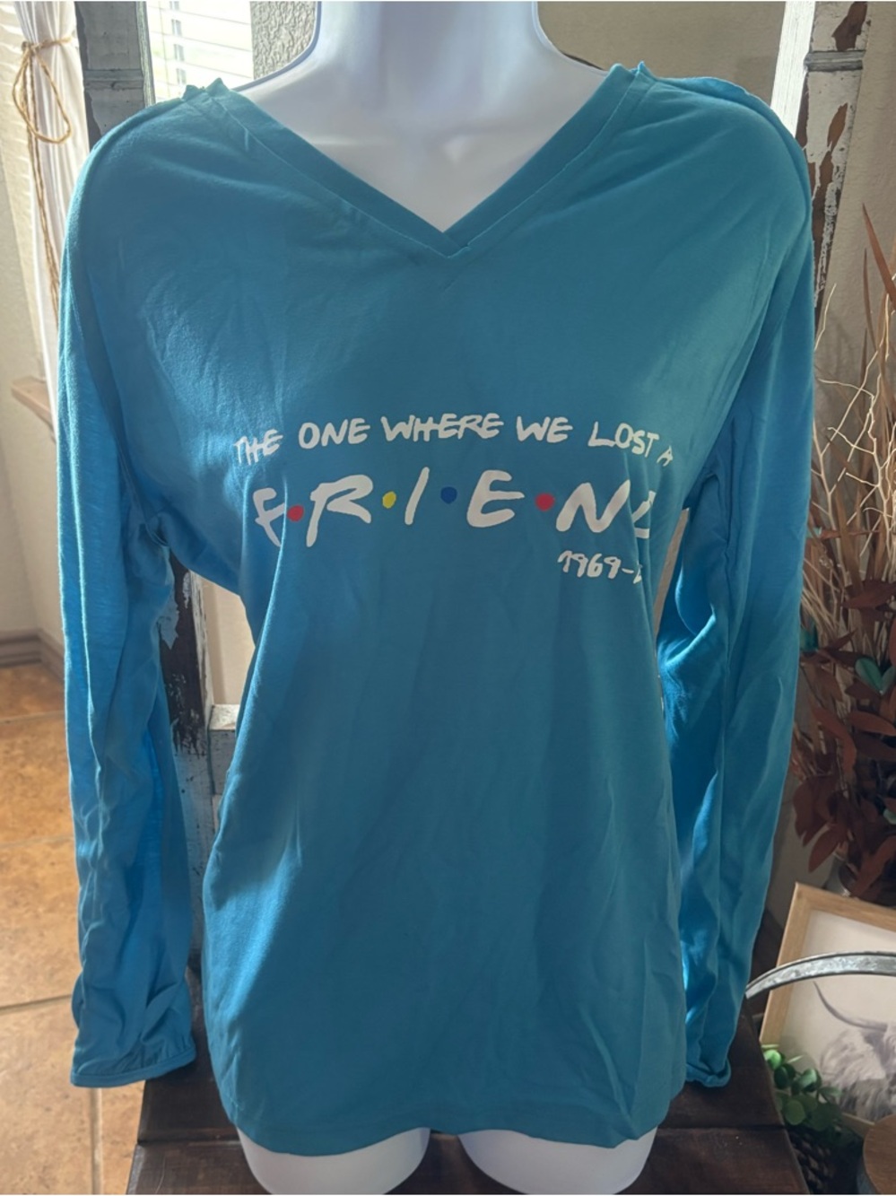 Friends Teal V-Neck Long Sleeve Tee “The One Where We Lost A Friend 1969-2023” 😔